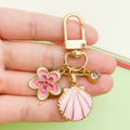 Starfish, Conch and Shell Charm Keychains Featuring Navy Flower Across 64 Variations view 2