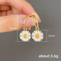 Gold Enamel White Daisy Charm Huggie Hoop Earrings view 5
