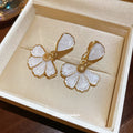 White Enamel Flower Drop Stud Earrings with Gold Tone Edges view 4