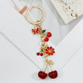 Gold Heart Clasp Charm Keychain With Bow Cherry Accent view 7