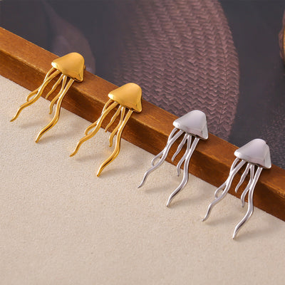 Gold and silver jellyfish tassel studs on wood ledge