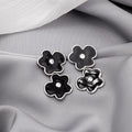 Black Green Enamel Flower Stud Earrings Silver Rim Center view 2
