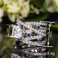 Silver Tone Crossover Ring With Blue And Clear Square Stones view 4