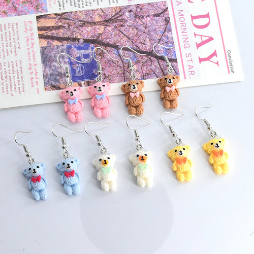 Close-up showing the colors and surface details of miniature Flocked Bow Bear Hook Earrings in Four Colors