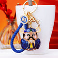 Colorful Wealth Deity Character Keychain with Gold Tone Hardware view 2