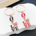 Brown and Red Football Love Letter Keychain Pair with Metal Hardware view 2