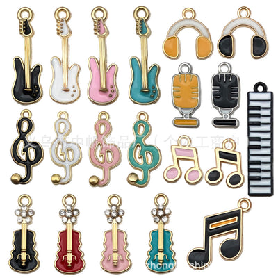 Colorful musical instrument and guitar charms arranged on a light background