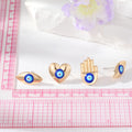 Gold Tone Hamsa Heart and Eye Stud Earrings in Three Designs view 5