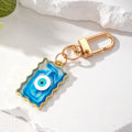 Gold Tone Wavy Rectangle Resin Evil Eye Clip Keychains in Six Colors view 7