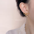 Gold 3D Cube Segment Bow Stud Earrings Geometric Pair view 2
