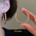 Gold Tone Double Layer Textured Crossover Hoop Earrings view 3