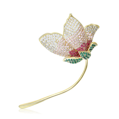 Pink gradient zircon flower brooch gold stem green leaves white background