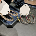 Multicolor Crystal C Hoop Earrings with Gold Tone Settings view 1