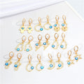 Gold Tone Evil Eye Huggie Earrings with Ten Symbolic Drop Designs view 1