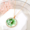 Gold Tone Round Resin Pressed Daisy Pendant Necklaces in Six Colors view 3
