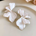 White Iridescent Dimensional Petal Flower Stud Earrings view 6