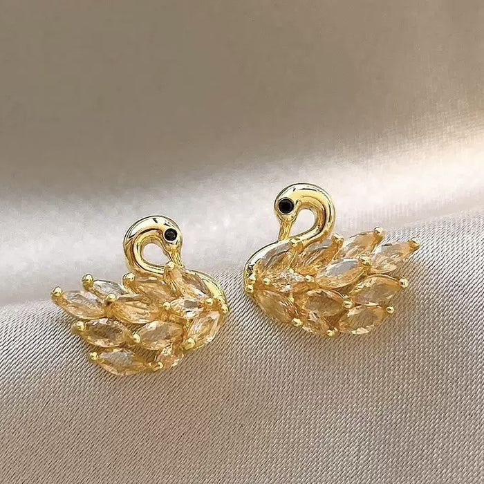 Gold Tone Crystal Swan Stud Earrings With Textured Wings