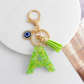 Green Glitter Letter Keychain with Evil Eye Charm and Suede Tassel view 2