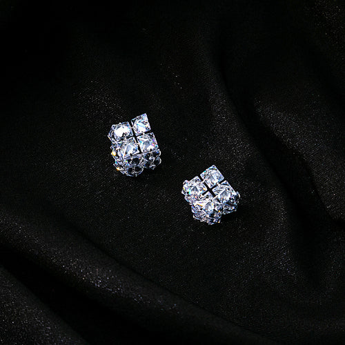 Clear crystal cluster studs on black fabric with sparkle