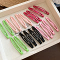 Glossy Enamel Openwork Oval Snap Hair Clips 4-Pack Black view 4