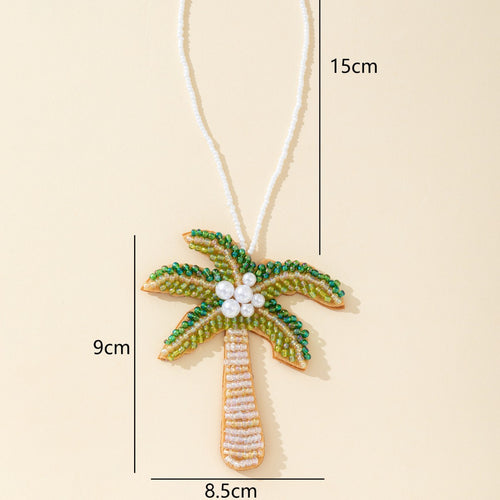 Green beaded palm tree charm pendant labeled 15cm strand, 9cm tall and 8.5cm wide