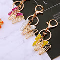 Hollow Crystal Butterfly Keychains in White Fuchsia and Yellow view 2