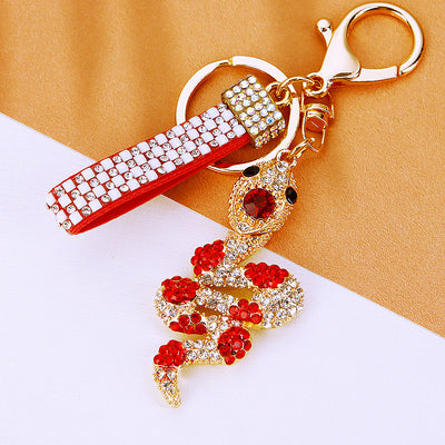Main image 1 shows a supplied presentation of jeweled gem snake keychains with visible attached key hardware.