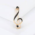 Black Enamel Treble Clef Brooch in Gold or Silver Tone view 1