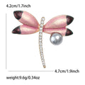 Pink Enamel Dragonfly Brooch With Polished Metal And Sculpted Decorative Details view 5