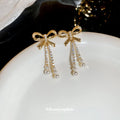Gold Tone Bow Stud Earrings With Pearl Chain Tassels view 4