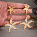 Gold Dual Starfish Drop Earrings with White Enamel Inlay view 3