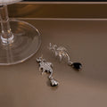 Silver Winged Bat and Black Teardrop Stud Earrings view 4