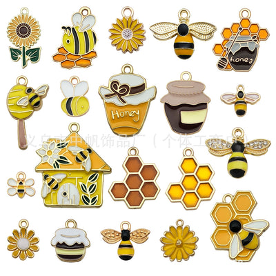 Colorful bee charms arranged on a light background