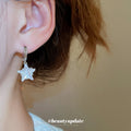 Silver Crystal Star Drop Hoop Earrings with Polished Metal Details view 3
