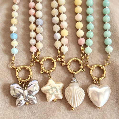 Alternate view showing the shape and hardware of the pictured pendant bead necklaces