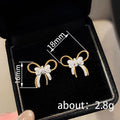 Gold Tone Bow Stud Earrings with Blue and Clear Stones view 4