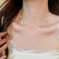 Gold Tone Floating Pearl Station Necklace with Polished Metal Tone Details view 3