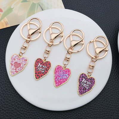 Overview showing the available color and design variations of the color printed heart metal clasp keychain