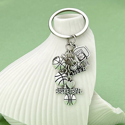 Image 1 showing a white vase with a silver keychain.