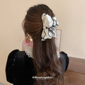 White Satin Bow Hair Claw With Black Piping And Pearl Like Center view 4