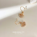 Gold Ginkgo Leaf Drop Earrings Clear Edge Stone Pair view 1
