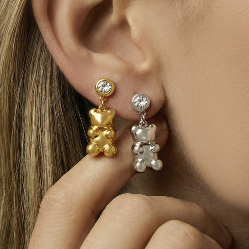 On-ear view of crystal bear drop earrings in main image 1.