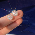 Silver Tone Clear Oval Stone Double Halo Stud Earrings view 1