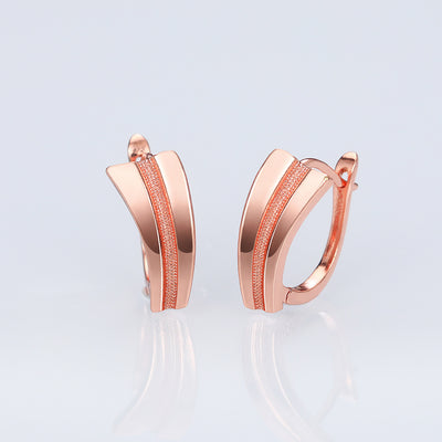 Front view of curved double bar hoop earrings in rose gold tone with clear crystal details