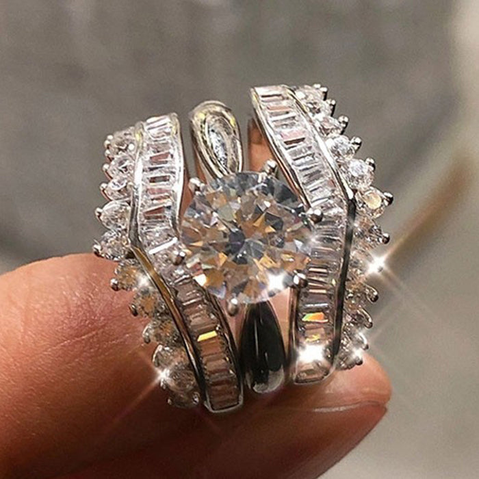 Wide Curved Baguette And Round Stone Ring Set In Silver Tone