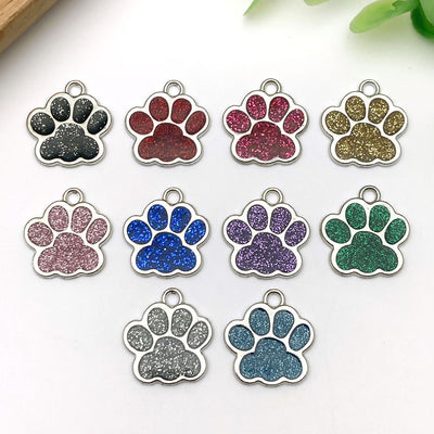Colorful assorted shape charms arranged on a light background