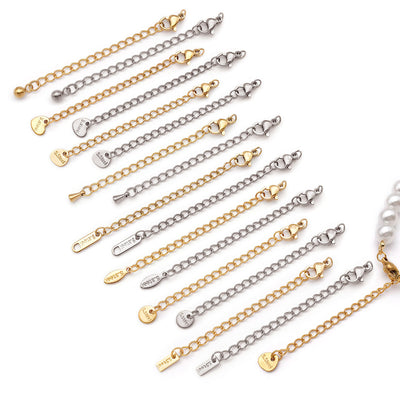 Gold-tone lobster clasp jewelry findings arranged on a light background