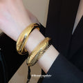 Seventeen Repeated Gold Or Silver Sculptural Open Cuff Designs view 4