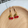 Mini Red Bead Cherry Dangle Earrings Green Leaf Gold Tone view 2