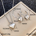 Silver Puffed Heart Pendant Necklace and Hoop Earrings view 5